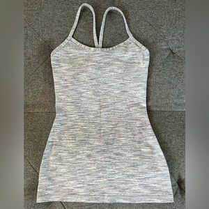 Lululemon workout top. White with gray printed design. Size 4